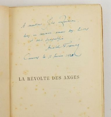 an open book with a handwritten poem on it sitting on top of a table