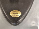 a close up of a metal object with a label on it