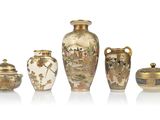 five different vases and one is decorated with flowers and birds