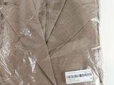 a piece of clothing wrapped in plastic on a white surface