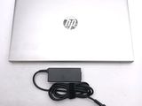a laptop and a charger sitting on a table