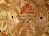 a brown hat with a label on it that says english fashion