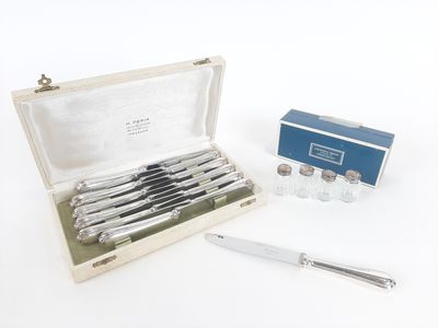 a box with a set of silverware and a knife in it