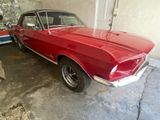 a red car that is parked in a garage