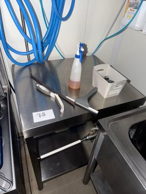 an image of a kitchen with a sink and a washing machine