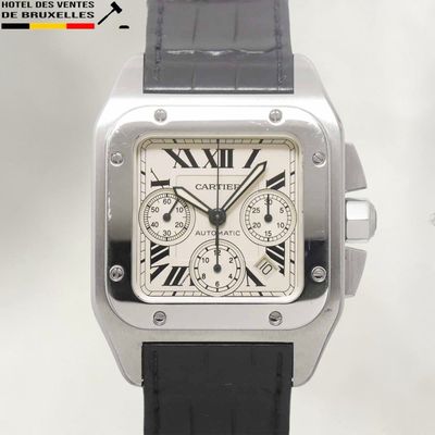 a close up of a watch with roman numerals on the face
