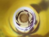 a close up view of a yellow banana with a black and white swirl