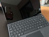 an open laptop computer sitting on top of a wooden desk