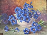 a painting of blue flowers in a vase on a table