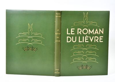 an old book with a green cover and gold lettering on it