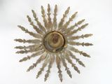 a gold sunburst on a white background