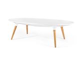 a white coffee table with wooden legs and a white top
