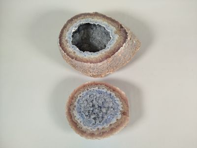 two pieces of stone that are sitting on a table