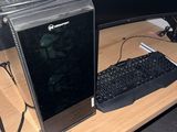 a desktop computer sitting on a desk with a keyboard and mouse