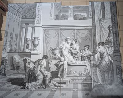 a man standing in front of a painting on the wall