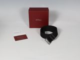 an image of a red box and a black belt on a white surface