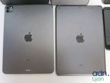 three ipads are sitting next to each other on a table