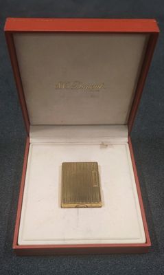 an image of a gold plated lighter in a red box