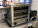 a toaster oven sitting on a counter in a kitchen