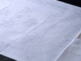 a white table cloth with a design on it