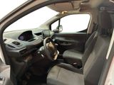 the interior of a car with the door open and the driver ' s seat down