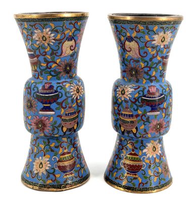 two vases that have been decorated with flowers on them