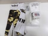 a pair of camouflage pants and a roll of toilet paper on a table