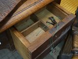 a wooden desk with a drawer that has a drawer in it