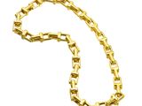 a close up of a gold chain on a white background