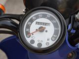 a close up of a motorcycle with a speedometer on it