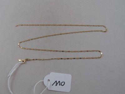 a close up of a gold chain with a tag on it