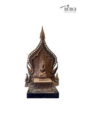 an image of a statue of a buddha sitting on top of a table