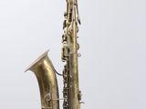 a close up of a brass saxophone on a white background
