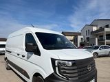 the white van is parked in a parking lot with other cars
