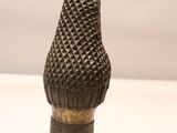 sculpture of a cone shaped object on a white surface