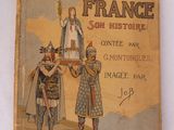 un vieux livre sur lequel figure l'image d'un homme et d'une femme debout l'un à côté de l'autre