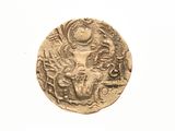 an old gold coin with an image of a woman and a man on it