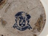 a white bowl with a blue and white design on it
