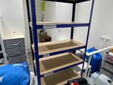 a room with a shelf and a chair in it