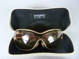 a pair of sunglasses sitting in a case on a table