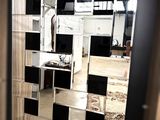 a mirror that is on the wall in the room