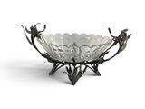 a close up of a glass bowl with flowers on it