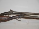 an old gun on display in a museum with a white background