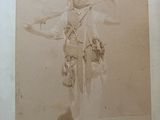 an old photo of a woman dressed in traditional clothing