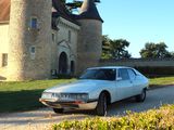 a car that is parked in front of a castle
