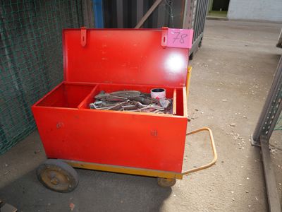 a red tool box with a lot of tools inside of it