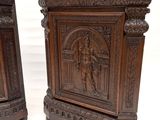 pair of antique carved wood side tables with figures on them
