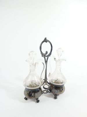 two glass vases that are sitting on a table