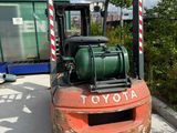 a forklift truck that is parked in a parking lot