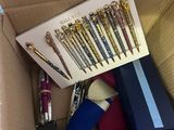 a box full of pens and pens that are in it